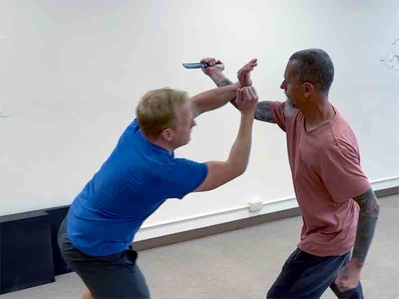 "Shit" aka a double forearm flinch spear block